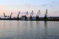 Cargo docks with dark cranesÃ¢â¬â¢ silhouettes after sunset, Varna Port, Bulgaria Royalty Free Stock Photo